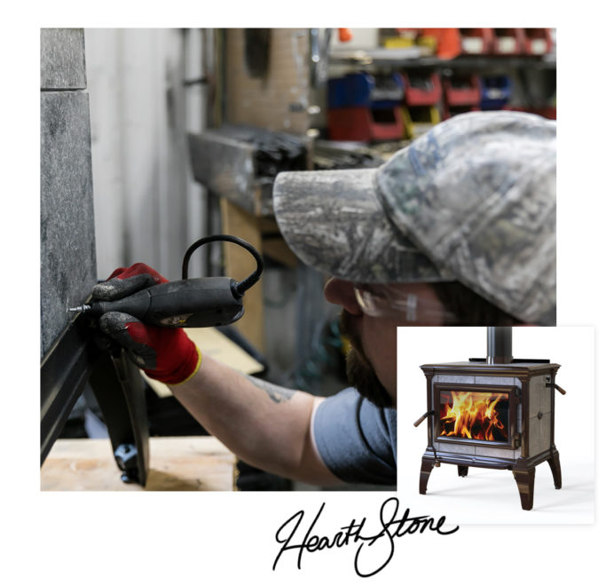A collier signs a hand crafter wood stove after it was made